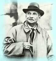 A black-and-white photograph of Sir Arthur Evans, the renowned British archaeologist who led the excavation of the Palace of Knossos in Crete. He is wearing a hat and a trench coat, with one hand tucked inside the coat, and has a thoughtful expression on his face.